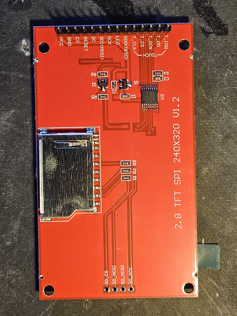 Back of the 2.8 inch ILI9341 SPI TFT module, showing the single top header carrying the display, power, and touch pins, the XPT2046 controller, and the microSD socket